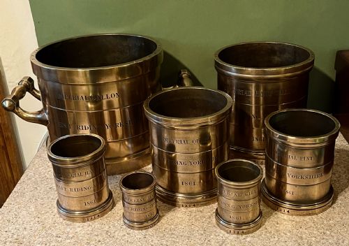 Set of 7 Bronze Measures Dated 1861