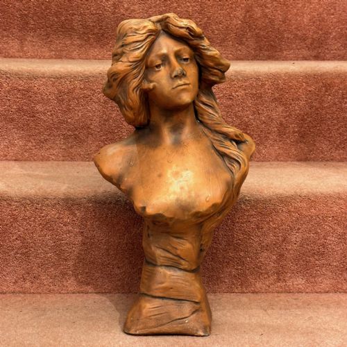 An Art Nouveau Terracotta Bust of a Semi-clad Young Lady