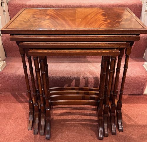 Nest of Four Walnut Veneered Occasional Tables