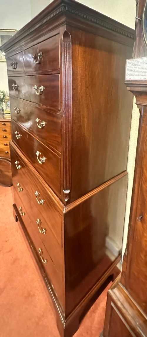 A tall George III mahogany chest-on-chest featuring two upper short drawers over three long drawers, resting on a base section with three further long drawers and bracket feet. View X