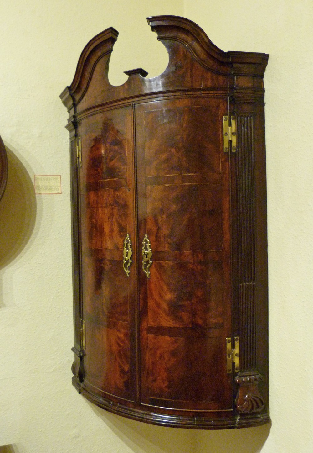 A REMARKABLE GEORGE II CORNER CABINET