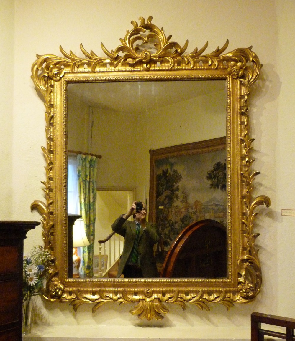 A FINE LARGE CARVED and GILDED OVERMANTEL MIRROR