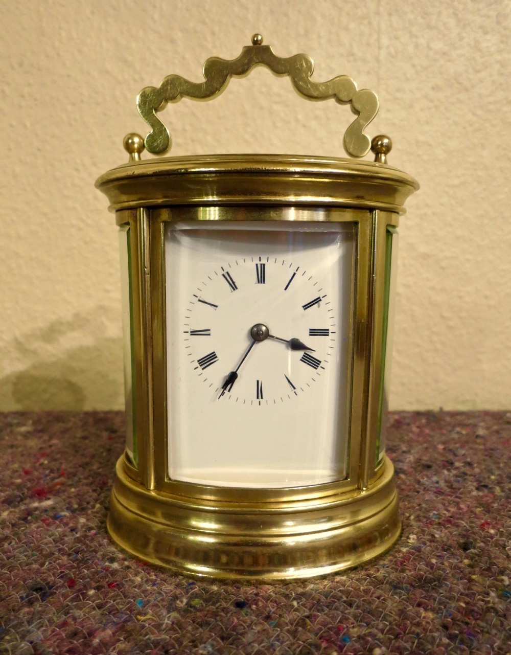 GOOD FRENCH OVAL STRIKING CARRIAGE CLOCK