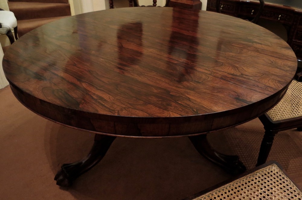 LARGE ROSEWOOD CIRCULAR DINING TABLE