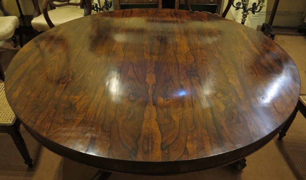 LARGE ROSEWOOD CIRCULAR DINING TABLE View II