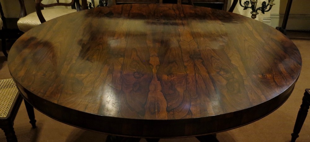 LARGE ROSEWOOD CIRCULAR DINING TABLE View III