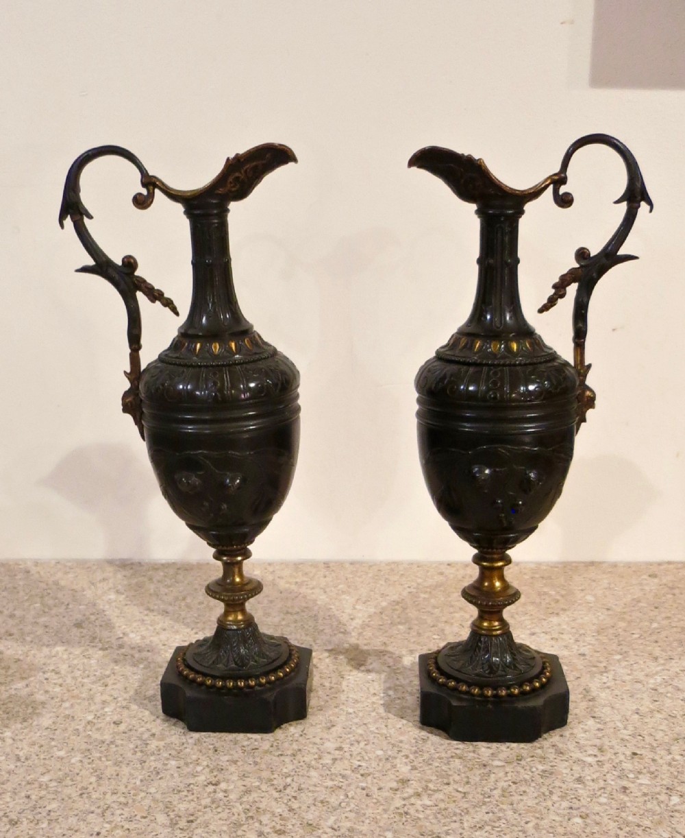 ELEGANT PAIR OF BRONZE EWERS
