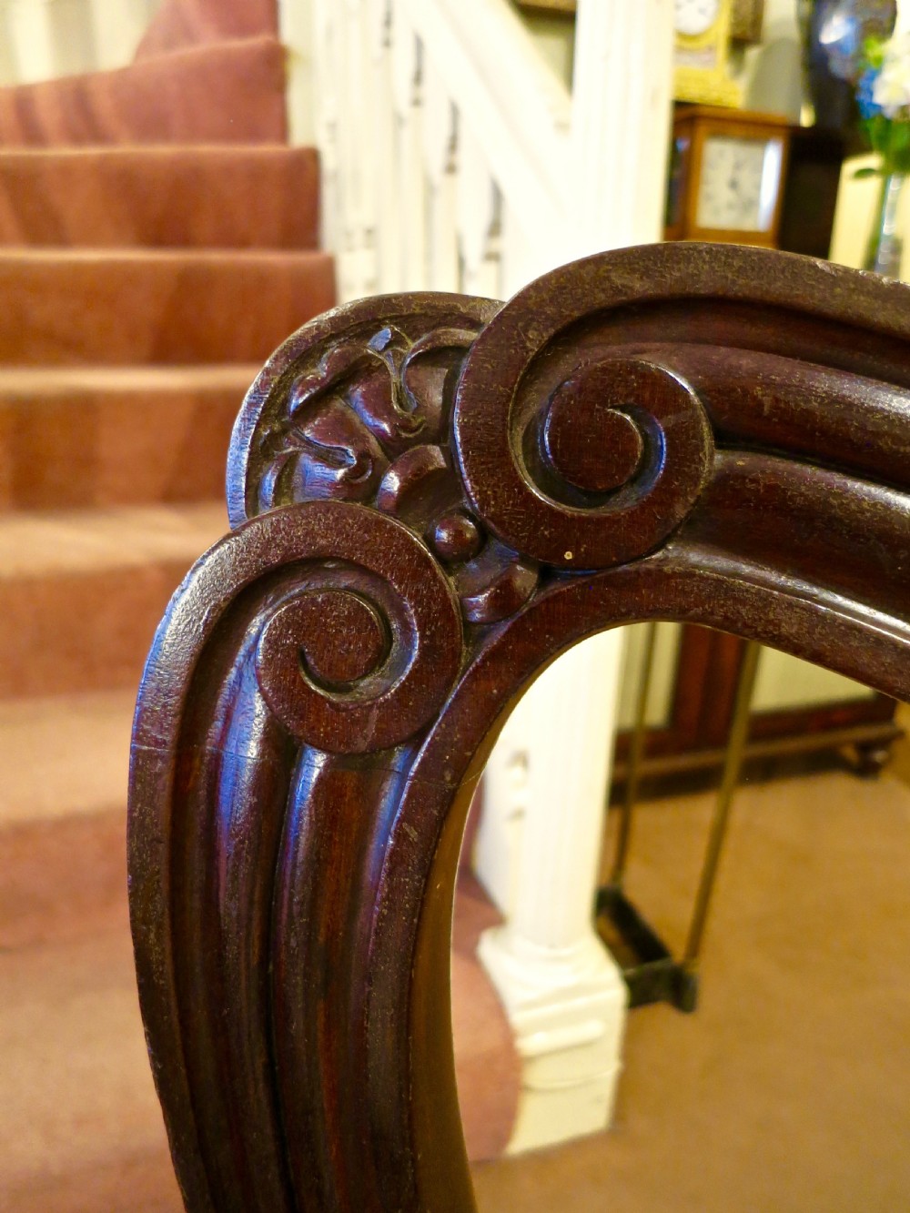 A pair of carved mahogany balloon-back dining chairs with brown velvet upholstered seats and fluted turned legs. View III