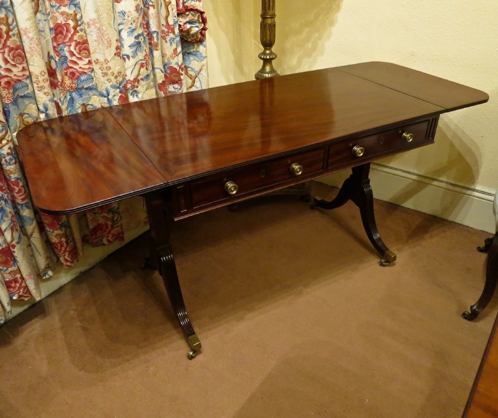 FINE FIGURED MAHOGANY SOFA TABLE BY GILLOWS