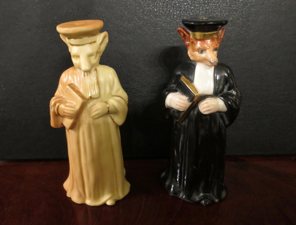 TWO ROYAL WORCESTER PORCELAIN CANDLE-SNUFFERS