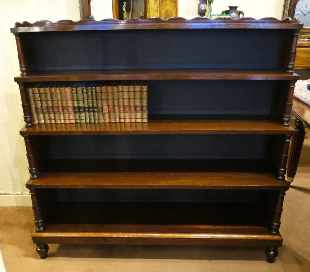 A FINE REGENCY ROSEWOOD 'WATERFALL' BOOKCASE View II