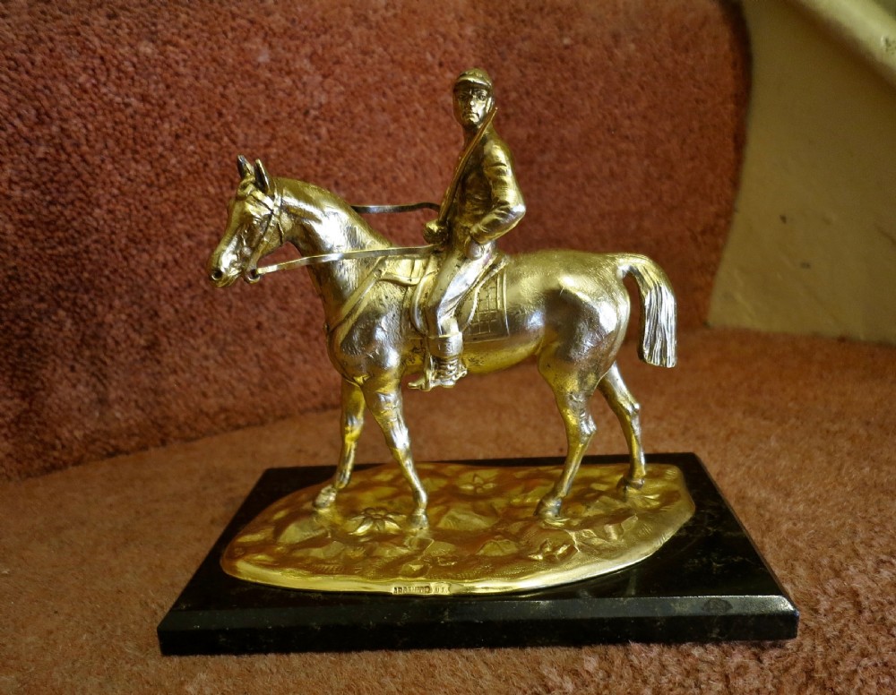 SOUTH AMERICAN SILVER-GILT HORSE & JOCKEY