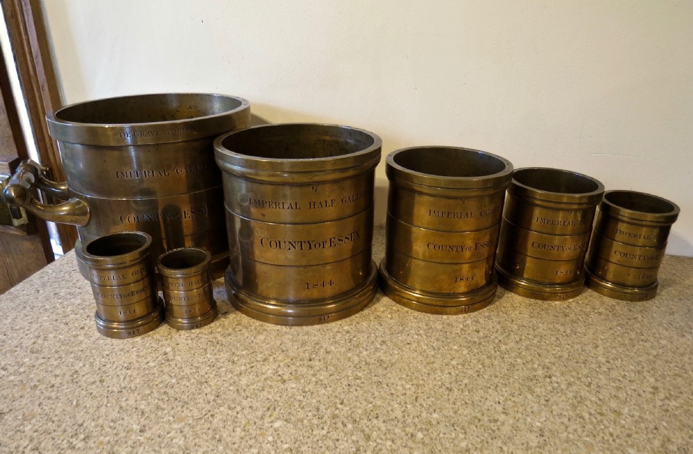 SET OF SEVEN BRONZE MEASURES DATED 1844