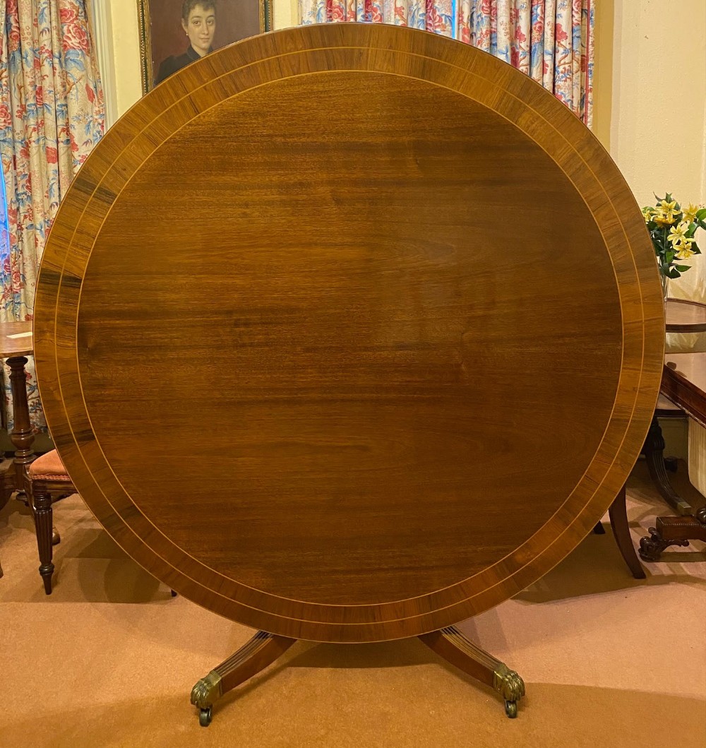 A large high-quality circular mahogany tilt-top Dining Table