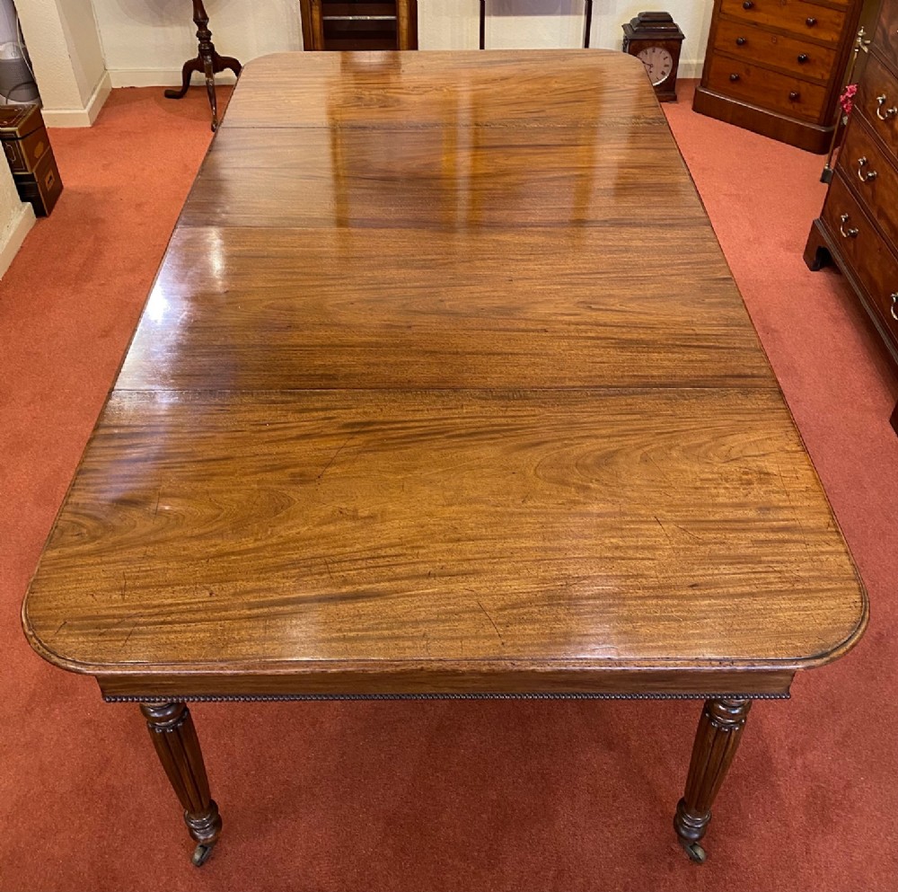 A Good early 19th century mahogany extending DINING TABLE (seats 10)