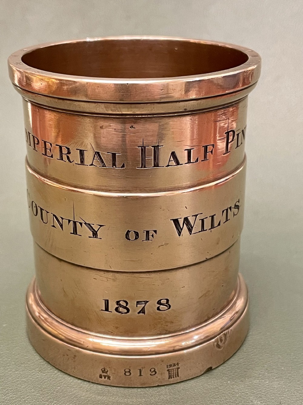 A good Customs & Excise Imperial Half Pint BRONZE MEASURE