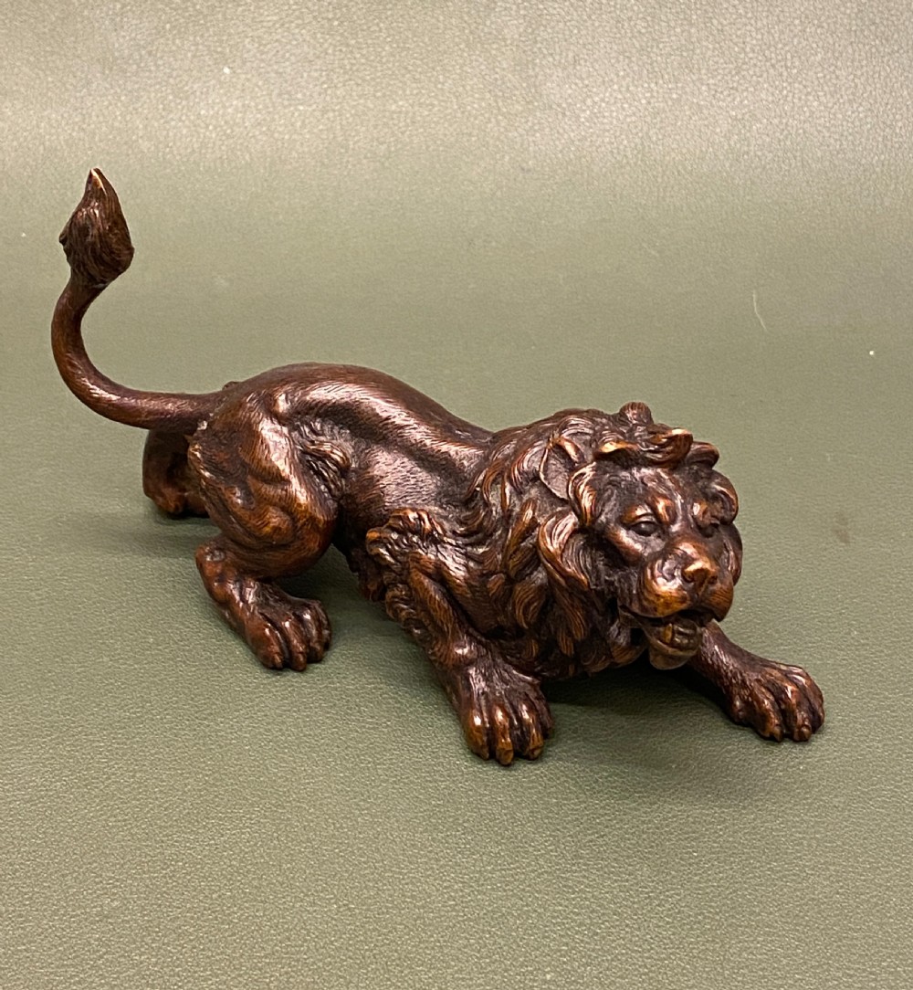 Late 19th century Austrian bronze (Geschutz) model of a crouching lion (5 inches long)