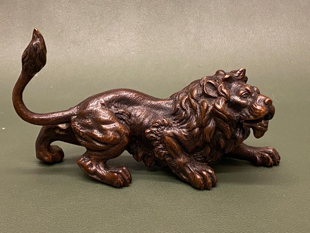 Late 19th century Austrian bronze (Geschutz) model of a crouching lion (5 inches long) View V