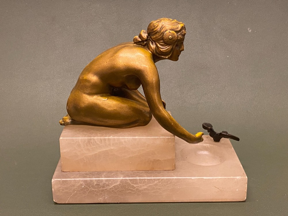 Bronze figure of a young naked woman kneeling, c1910-25 View IV
