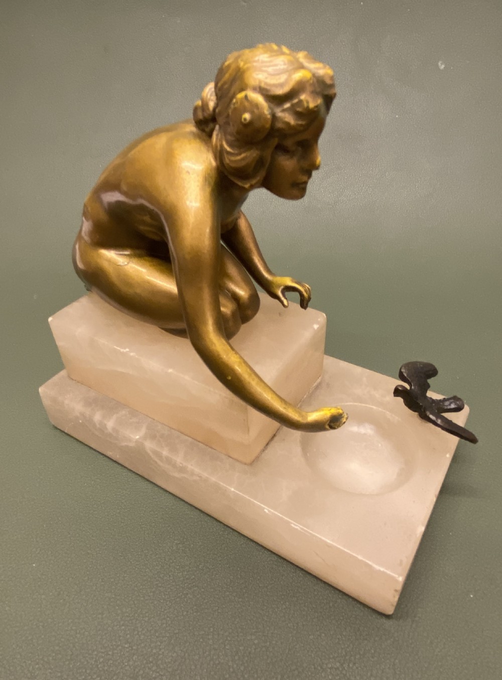 Bronze figure of a young naked woman kneeling, c1910-25 View VIII