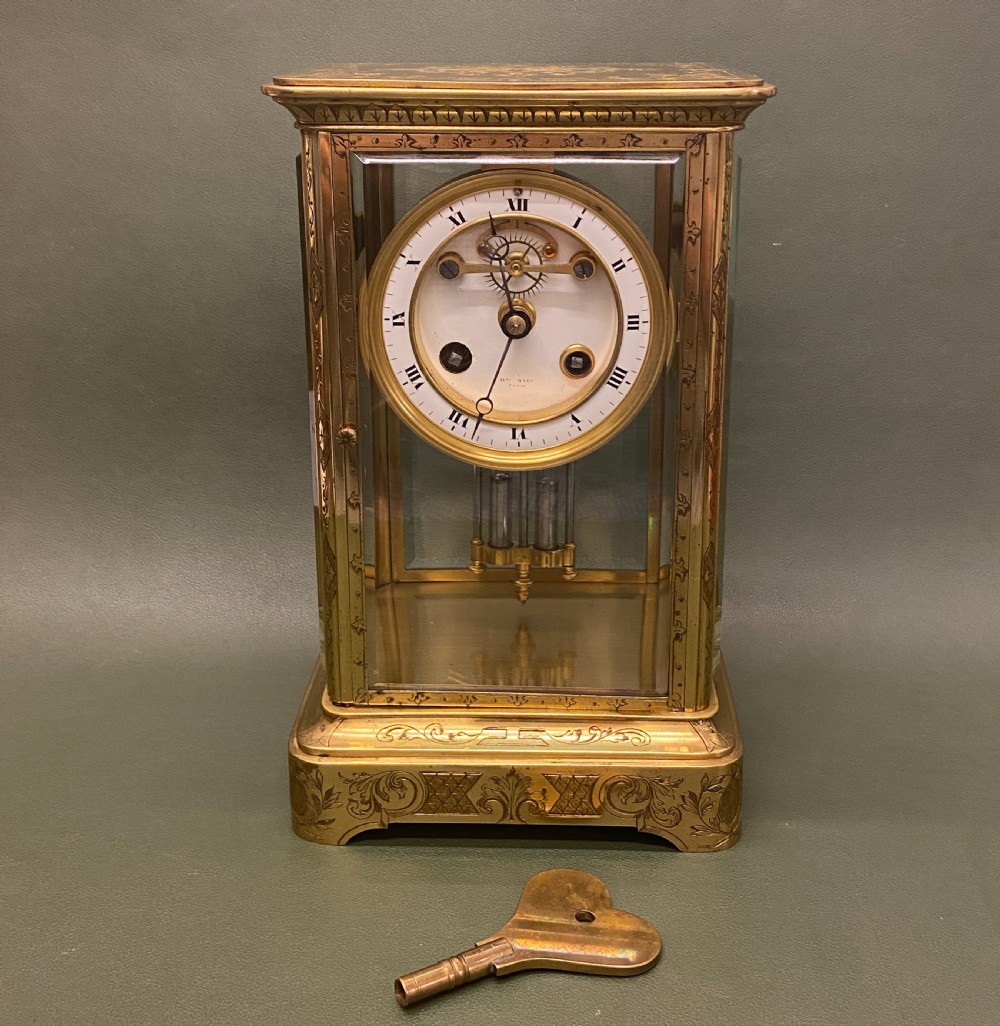 A good French engraved brass 4-glass Mantel Clock with mercury weighted pendulum View II