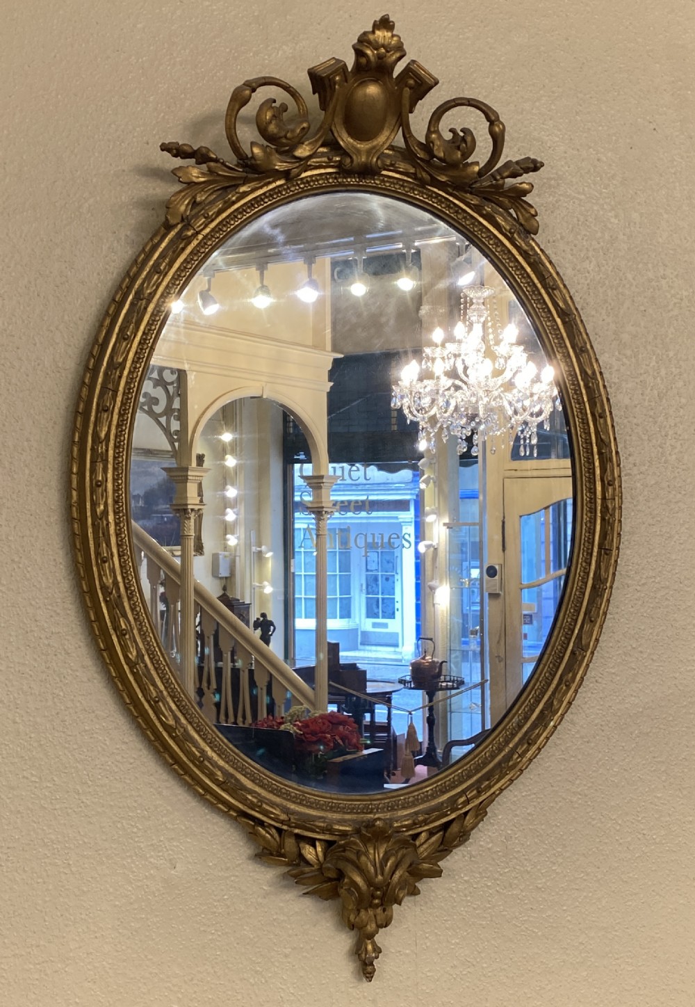 Victorian ornately framed oval mirror View II