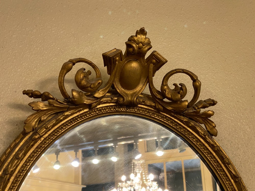 Victorian ornately framed oval mirror View IV