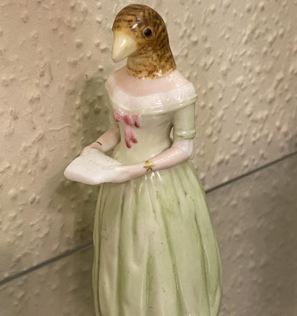 A rare Royal Worcester porcelain CANDLE-SNUFFER - 'Jenny Lind' (Diffidence) in green, 1892