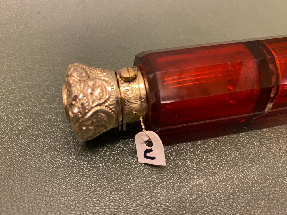 A Ruby glass DOUBLE-ENDED Scent Bottle with embossed gilt metal tops View II