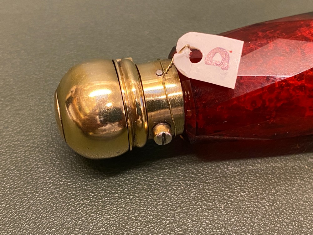A Ruby-Glass multi-facted DOUBLE-ENDED Sent Bottle with Gilt Metal ends View II
