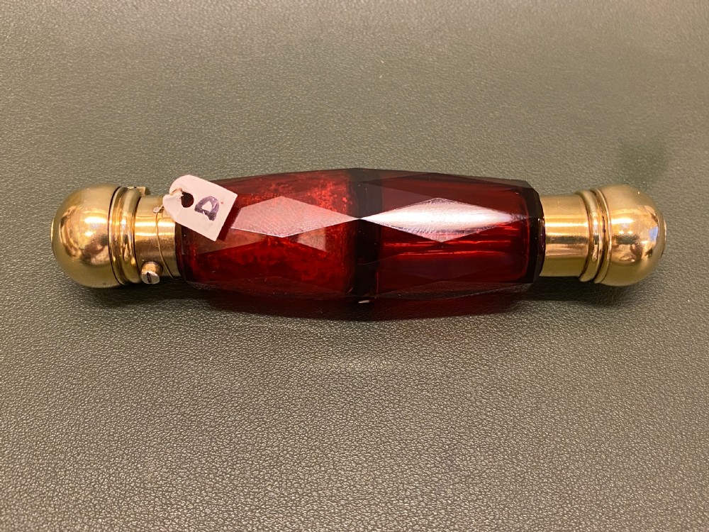 A Ruby-Glass multi-facted DOUBLE-ENDED Sent Bottle with Gilt Metal ends