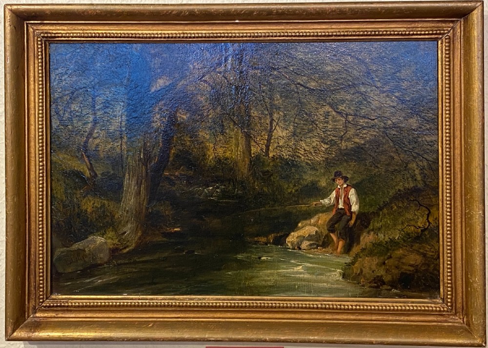 An 1856 Victorian oil painting on board depicting a figure fishing along a wooded stream, displayed inside a gilded frame. View IV