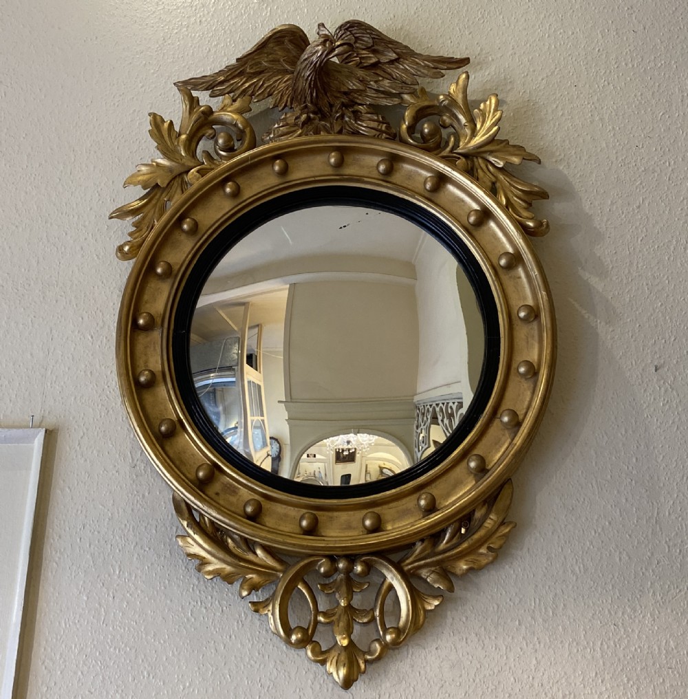 Regency style giltwood framed circular convex wall mirror