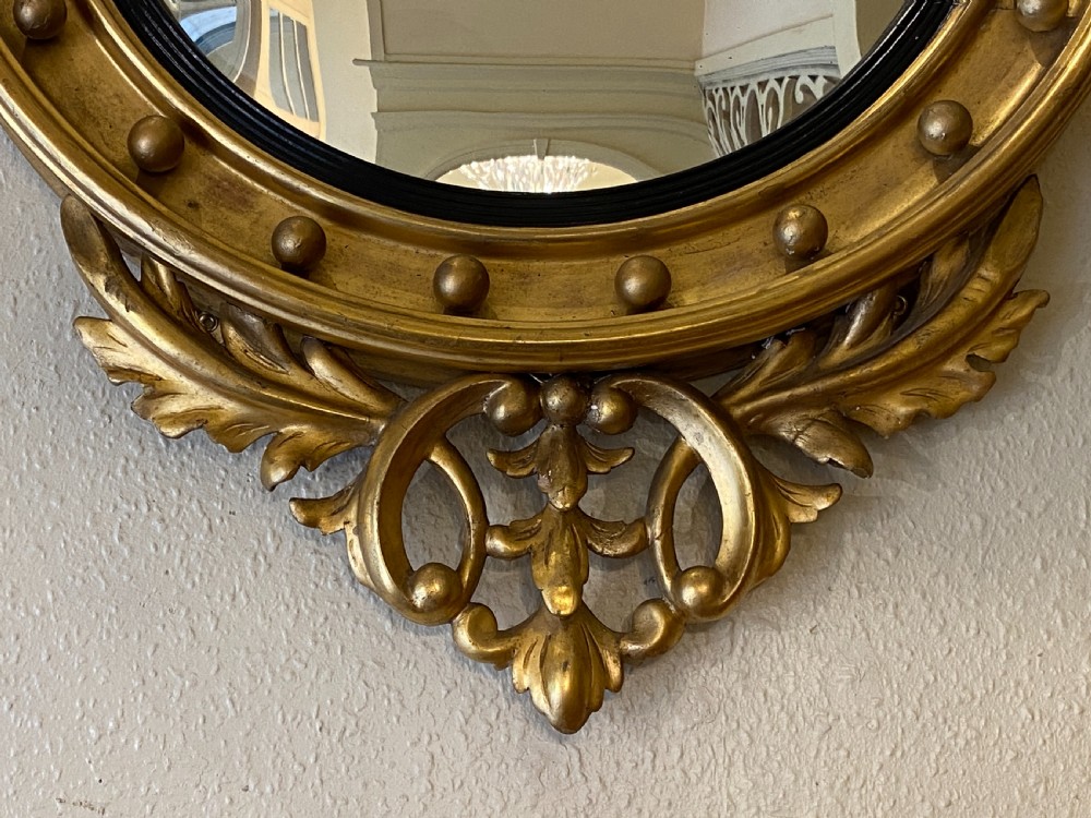 Regency style giltwood framed circular convex wall mirror View V