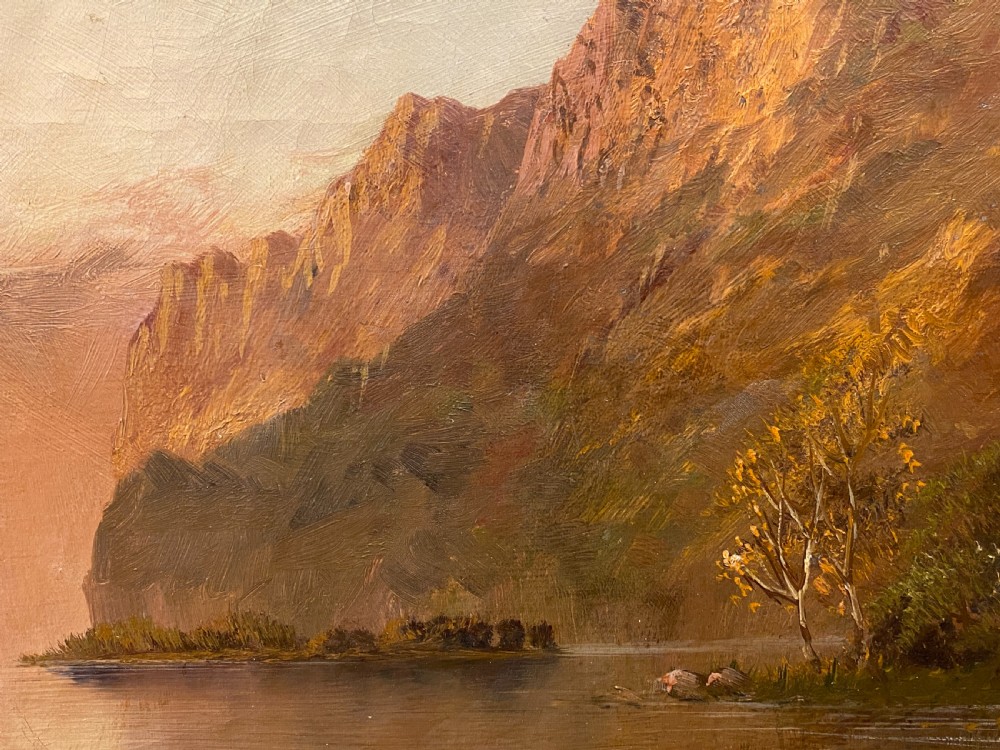 A Victorian oil painting on canvas by Gustave De Breanski depicting a mountainous lake view at sunrise in an ornate gilt frame. View IX