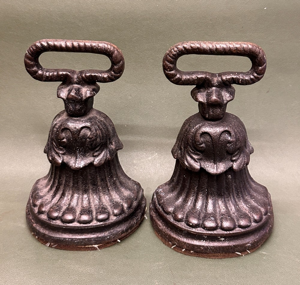 A PAIR of 19th century Kenrick cast-iron weighted Doorstops