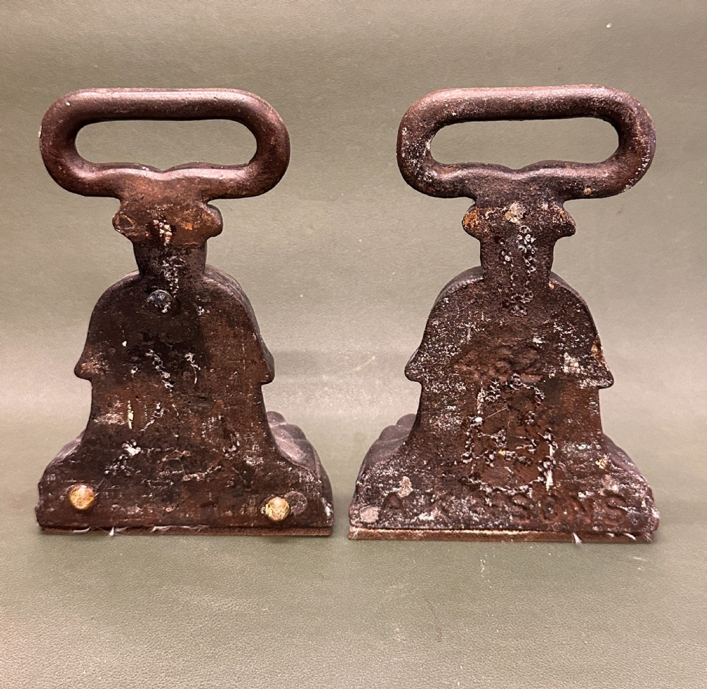 A PAIR of 19th century Kenrick cast-iron weighted Doorstops View III