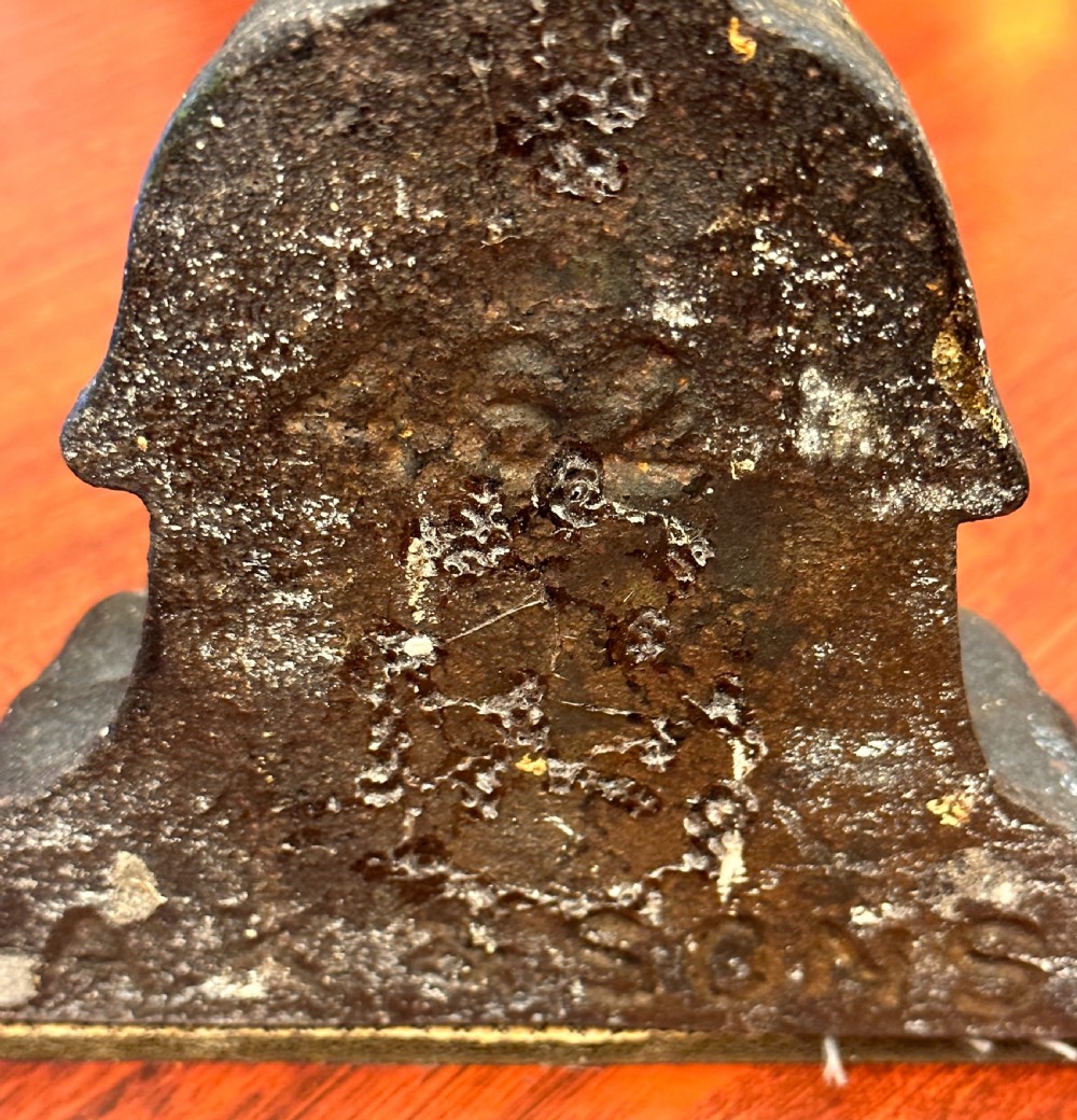 A PAIR of 19th century Kenrick cast-iron weighted Doorstops View VII