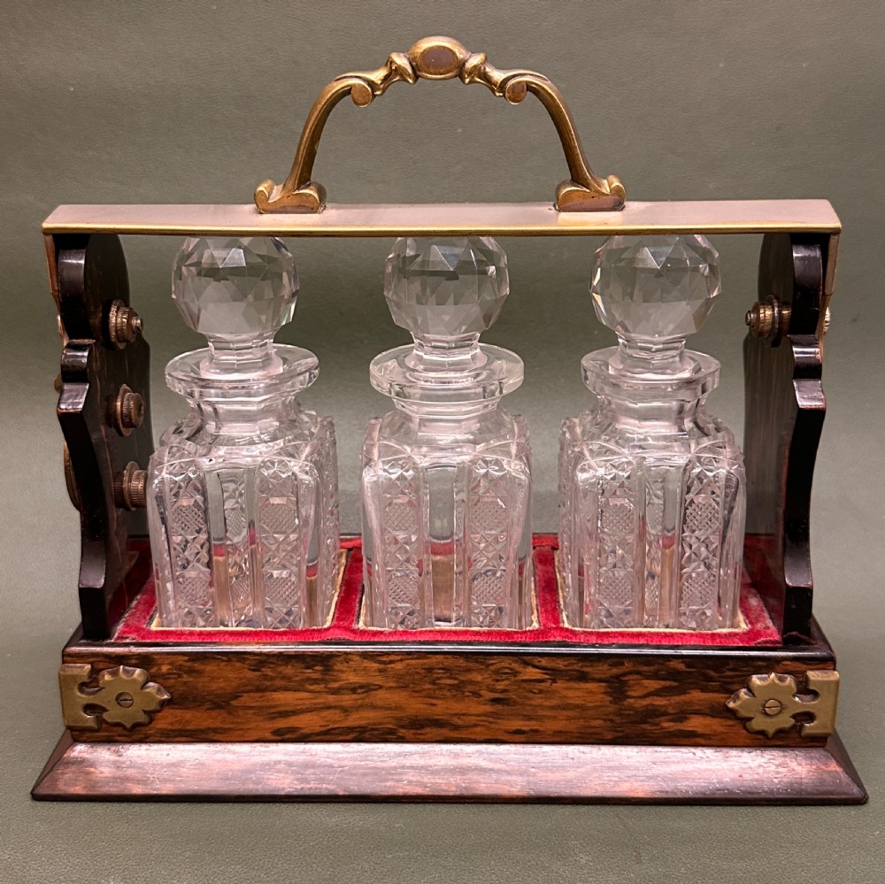 Coromandel-wood 3-decanter Tantalus of smaller size, by Betjemann of London