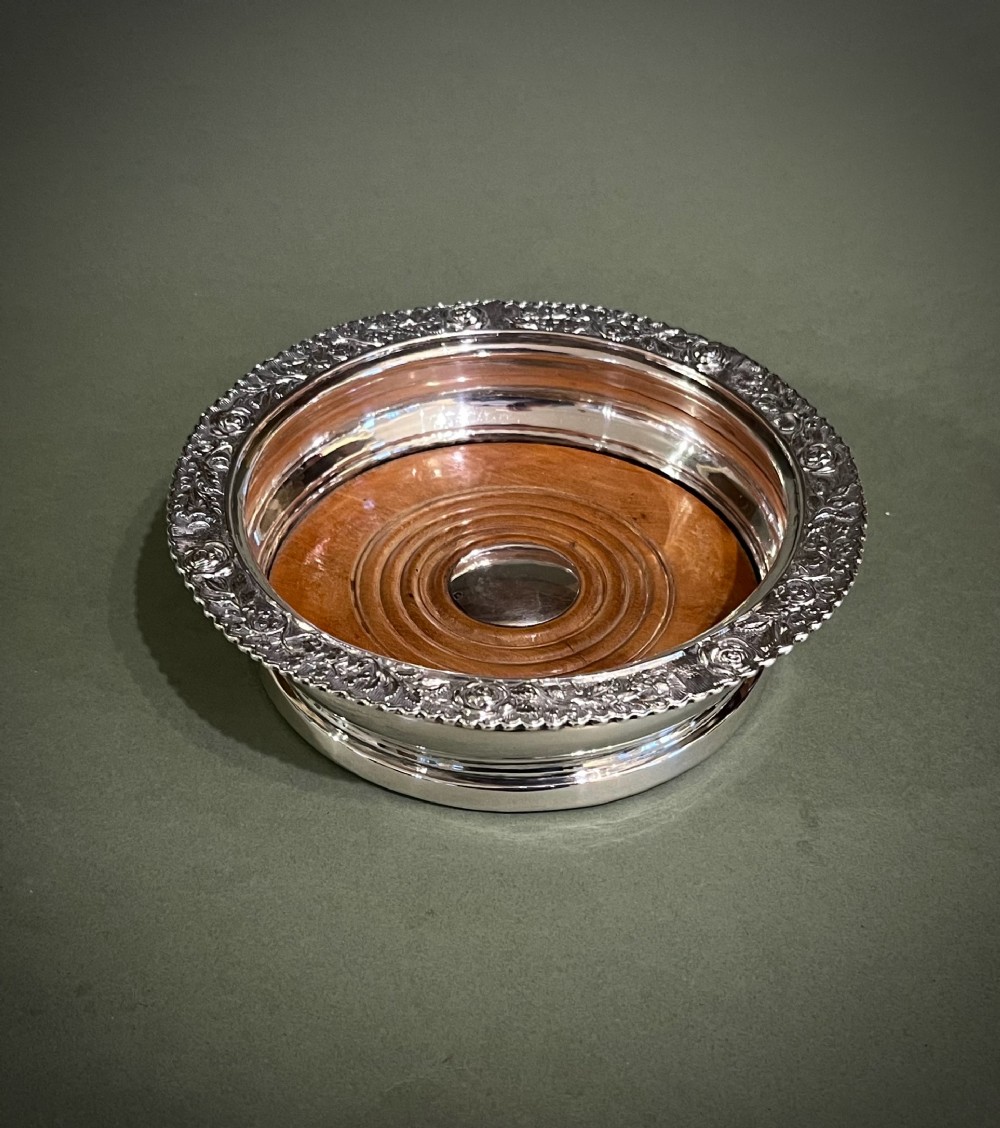 A GOOD GEORGE IVTH SILVER WINE COASTER