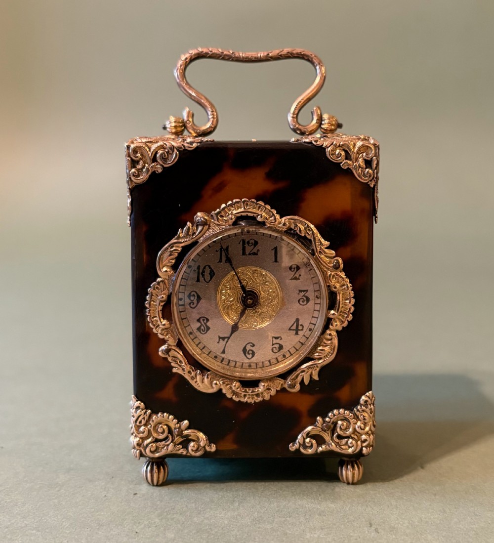 A CHARMING GOLD-MOUNTED MINIATURE 