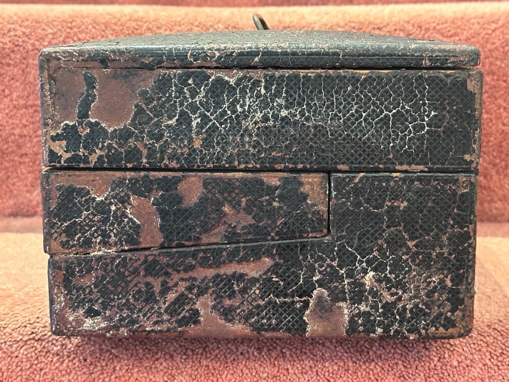 An open Victorian leather-bound writing box featuring internal letter slots, a pen tray, an inkwell compartment, and brass hardware. View XI
