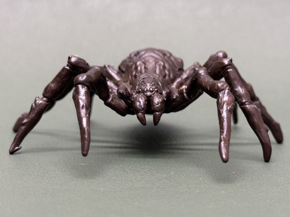 A detailed patinated dark brown bronze okimono sculpture modelled in the form of a tarantula spider. View II