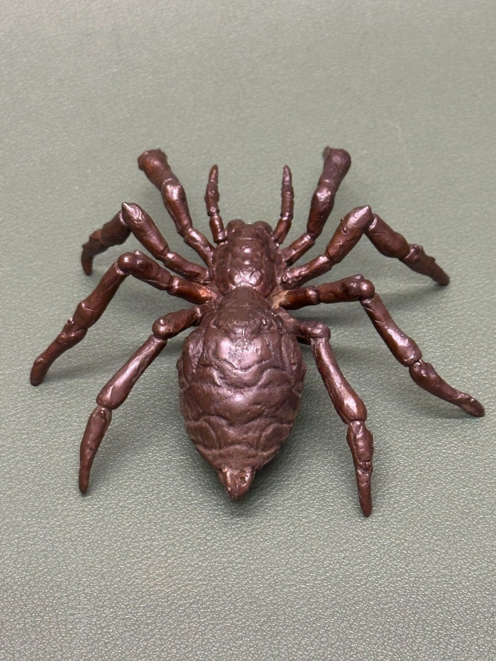 A detailed patinated dark brown bronze okimono sculpture modelled in the form of a tarantula spider. View III
