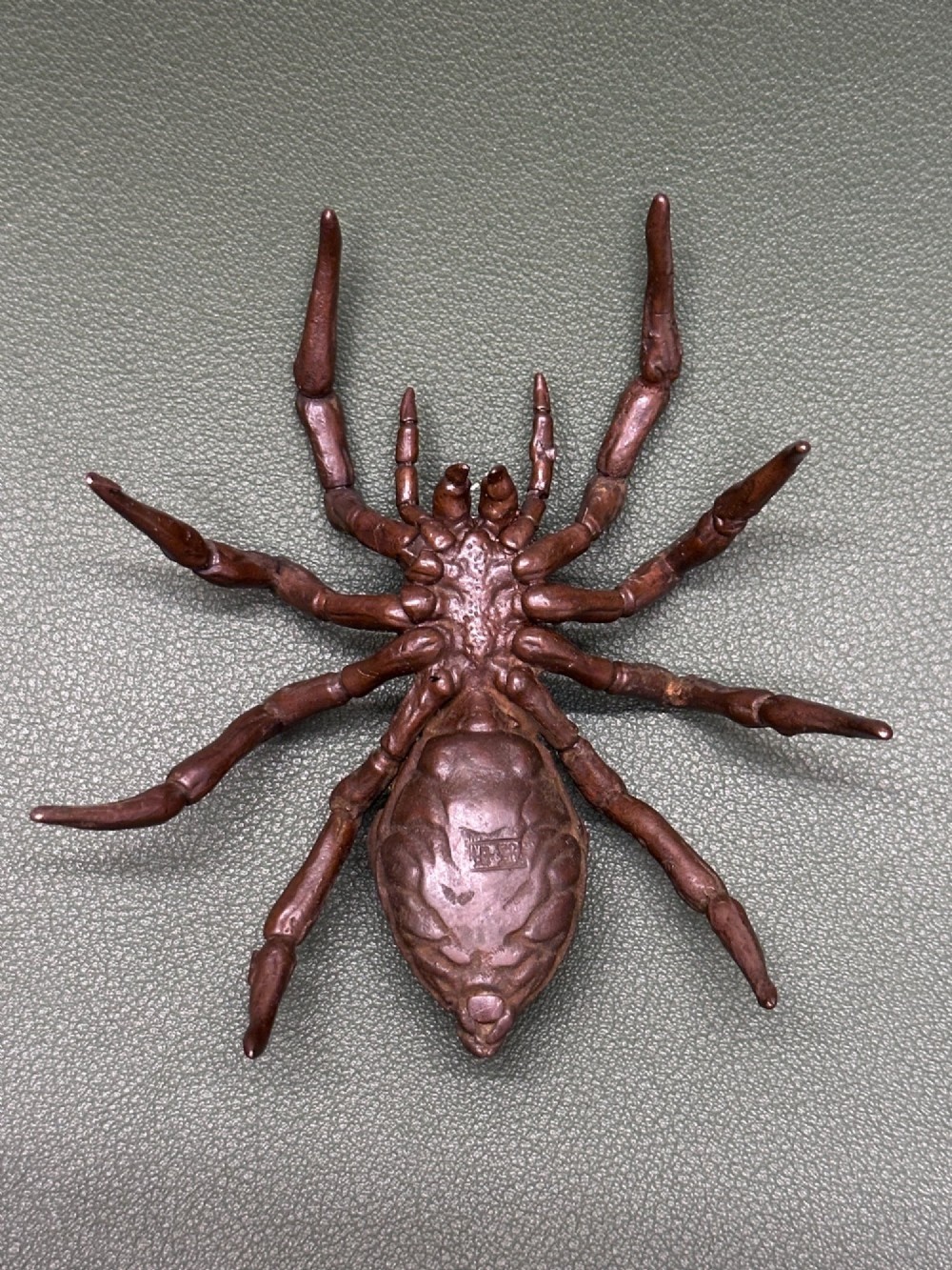 A detailed patinated dark brown bronze okimono sculpture modelled in the form of a tarantula spider. View VI