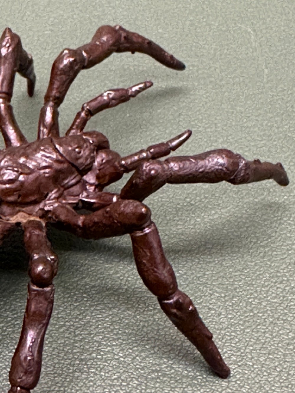 A detailed patinated dark brown bronze okimono sculpture modelled in the form of a tarantula spider. View IX