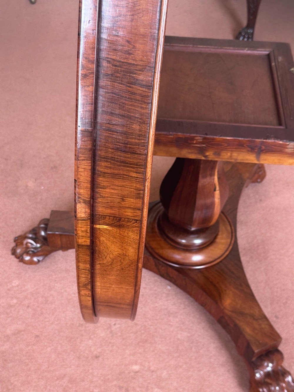 A circular William IV tilt-top rosewood centre table featuring symmetrical book-matched veneer and a central pedestal base with carved claw feet. View VIII