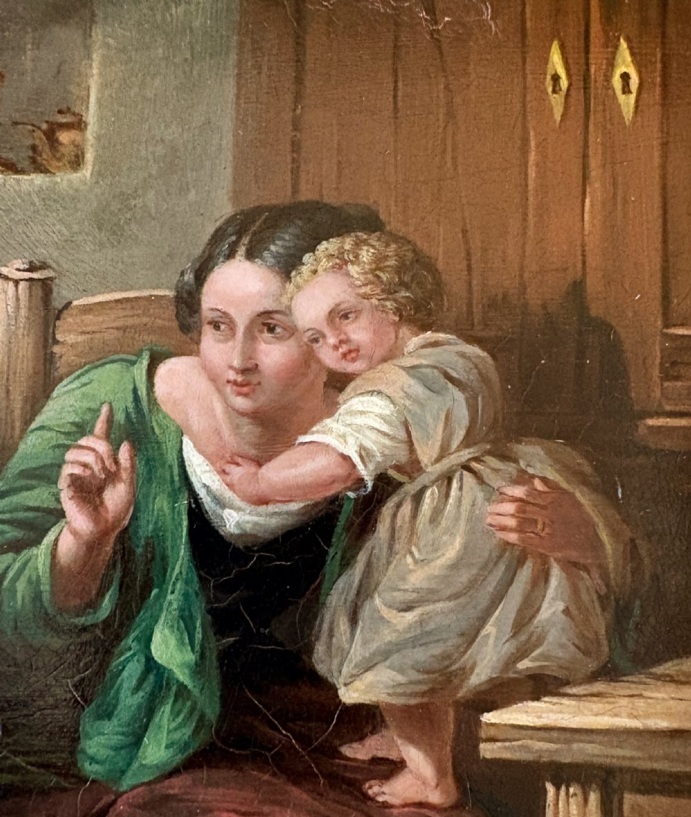A nineteenth-century narrative oil painting on a wooden panel depicting a grandfather visiting a mother and children in a cottage interior, framed in an ornate gold gilt frame. View IV