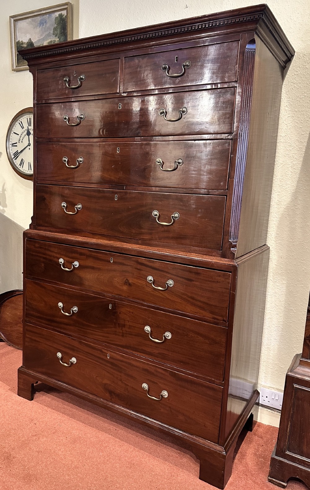 A tall George III mahogany chest-on-chest featuring two upper short drawers over three long drawers, resting on a base section with three further long drawers and bracket feet. View II