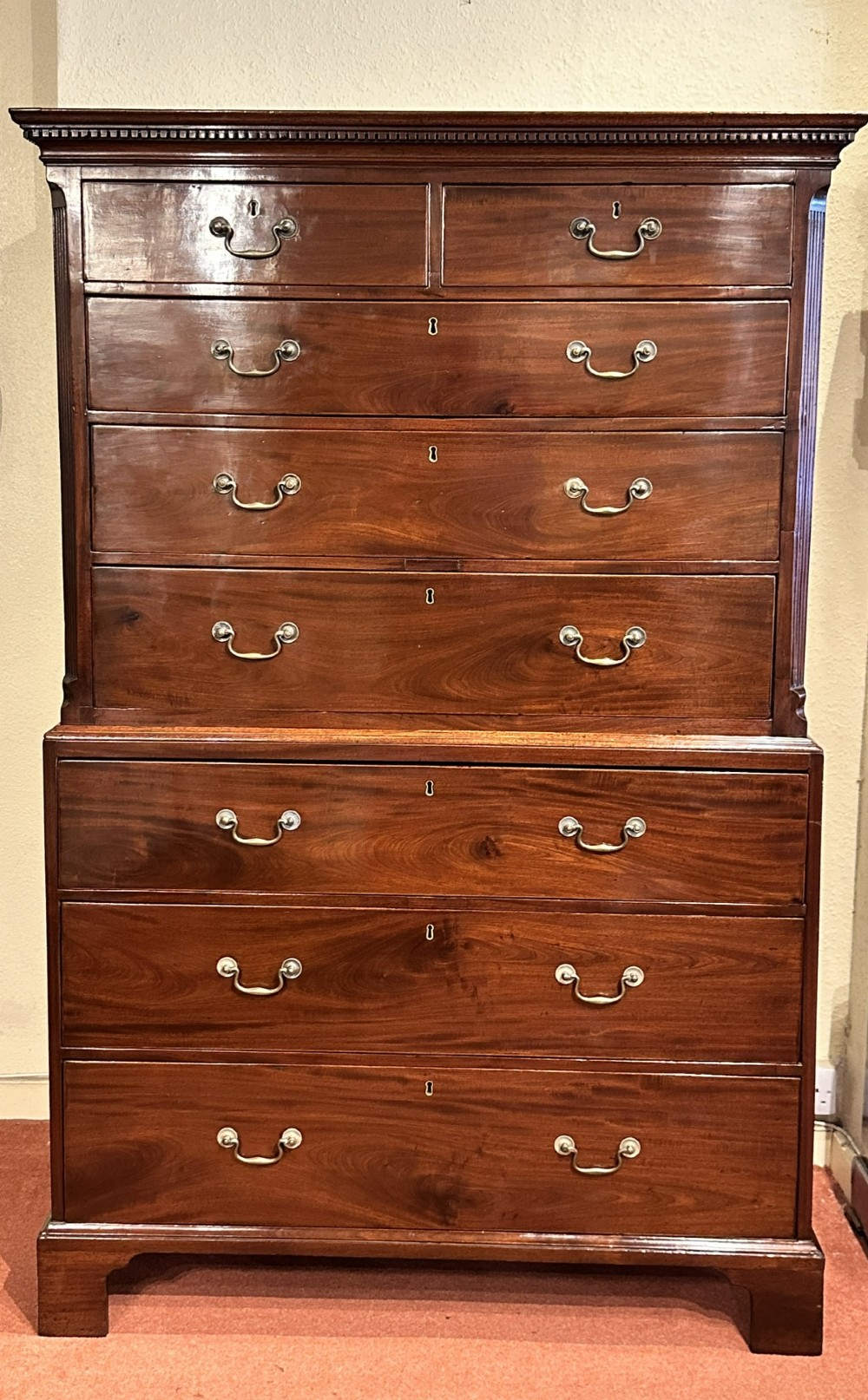 A tall George III mahogany chest-on-chest featuring two upper short drawers over three long drawers, resting on a base section with three further long drawers and bracket feet. View III
